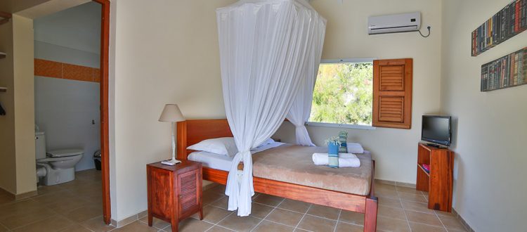 Chambre spacieuse avec lit confortable de la villa Coccoloba - Location Villa à Marie Galante